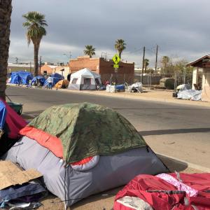Homeless tents lined up along a downtown Phoenix street