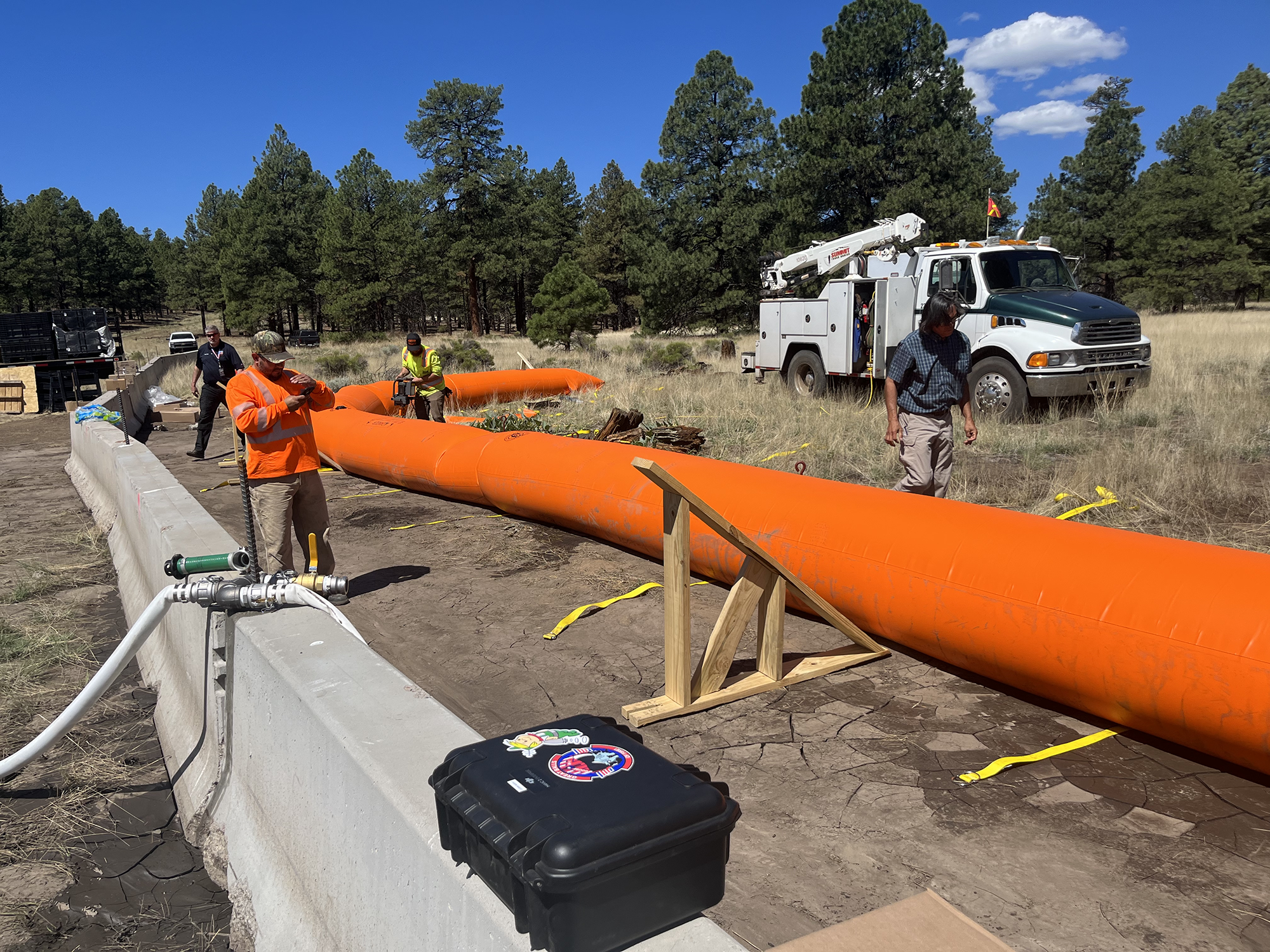 Installation of Tiger Dam flood barriers.