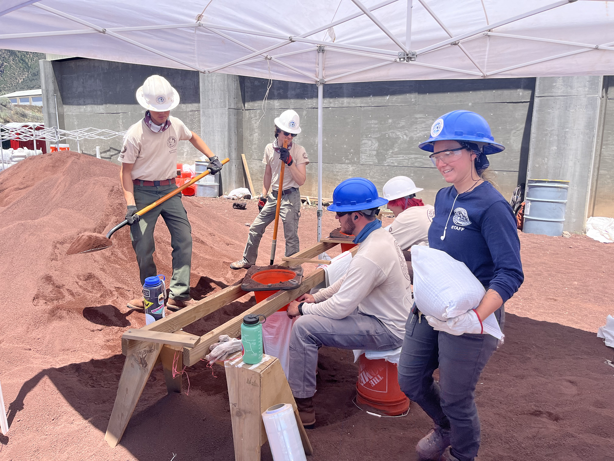 Volunteer crews filling sandbags.