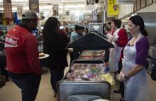 Volunteers serving food at St. Vincent de Paul in Phoenix